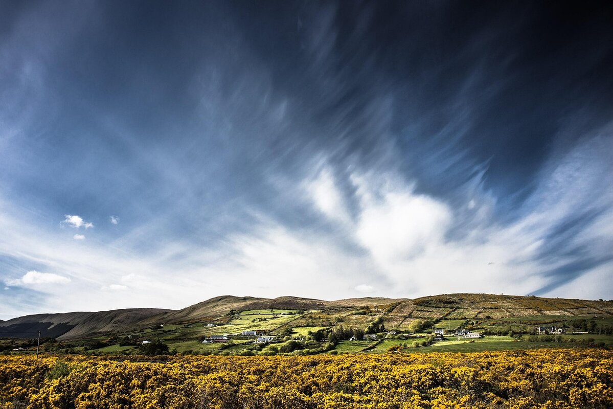 Beautiful Irish countryside landscape with rolling green hills and traditional stone walls